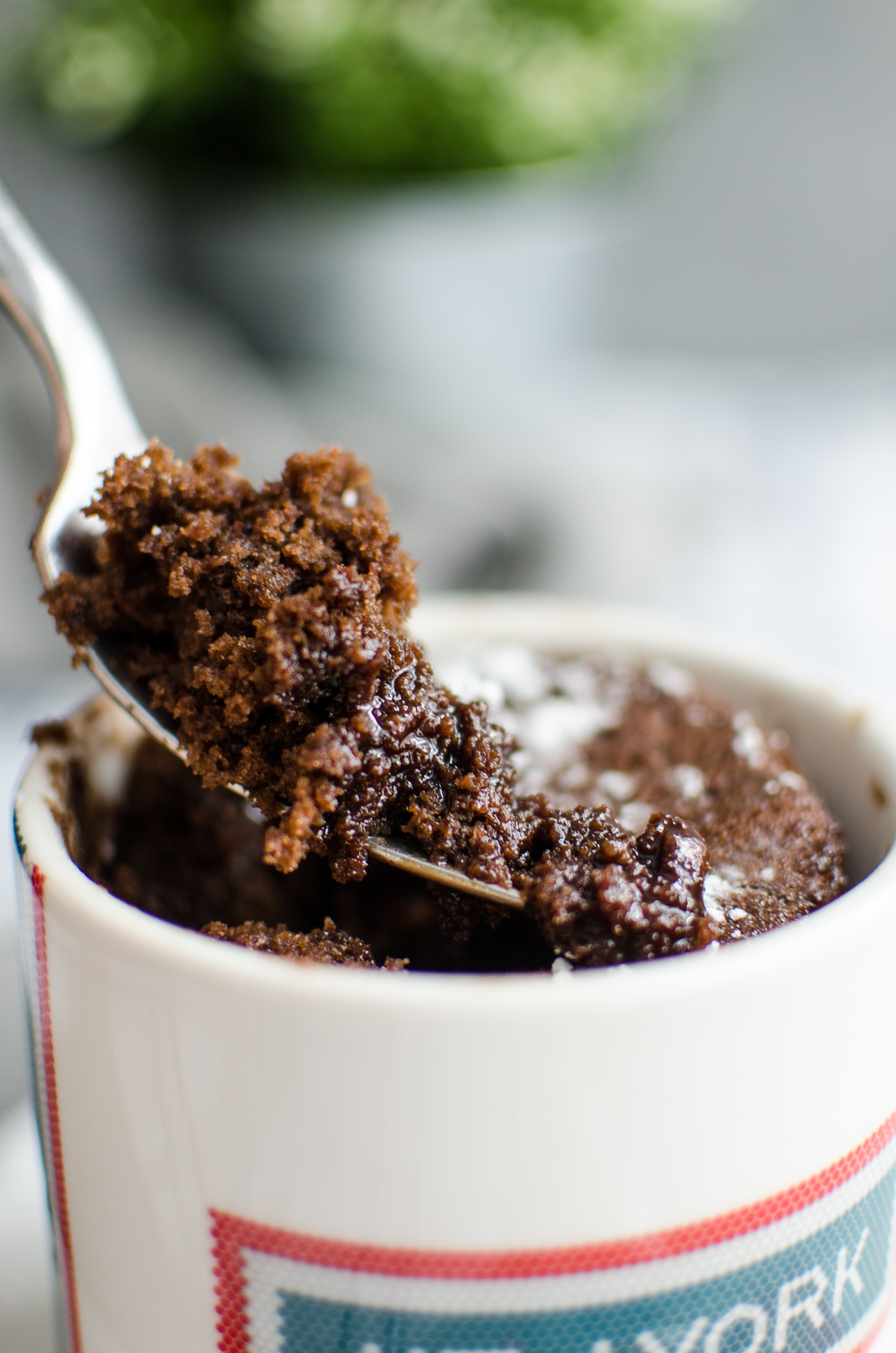 spoon with chocolate lava mug cake