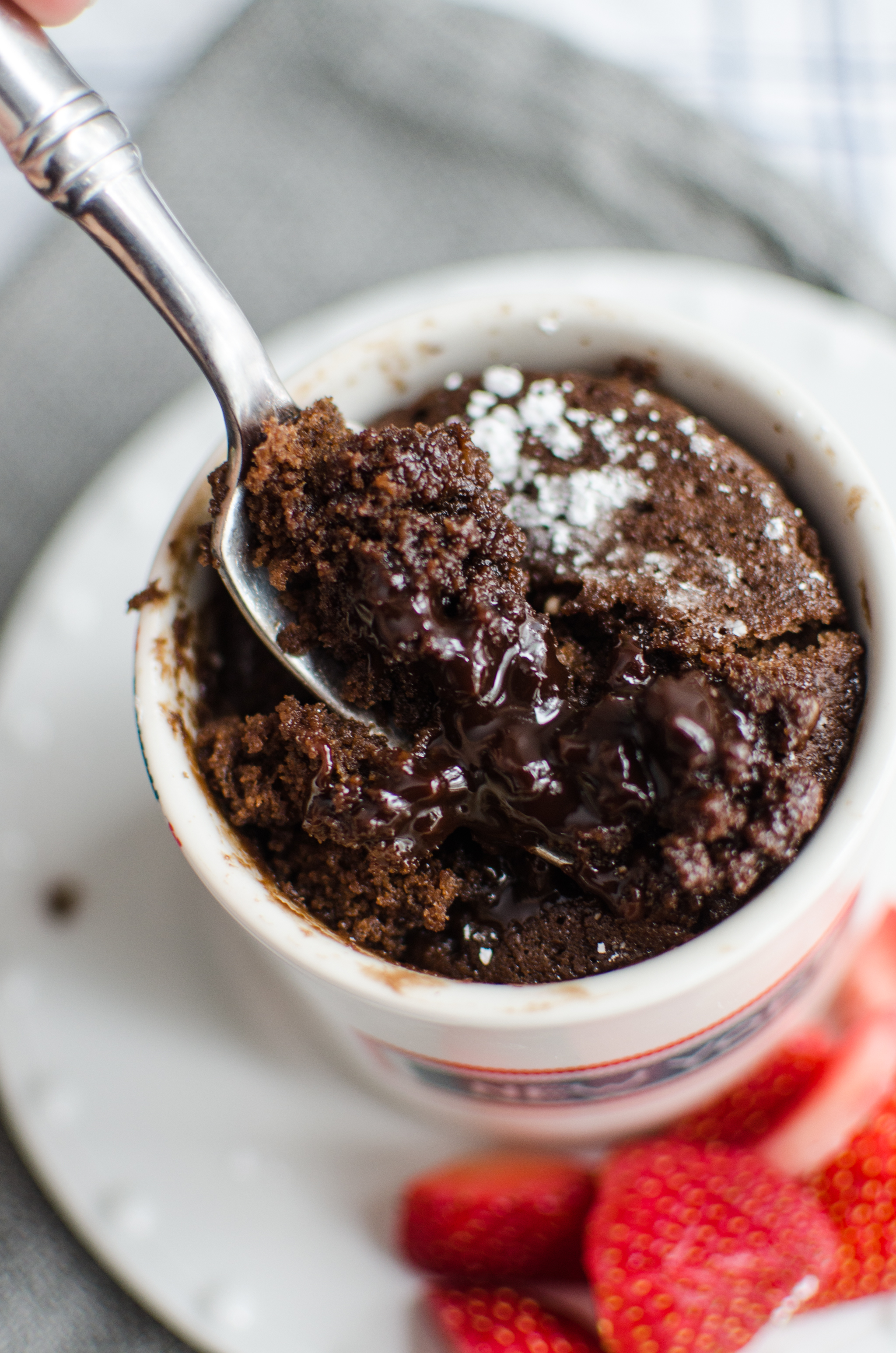 spoon with chocolate lava mug cake